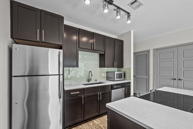 Kitchen with Stainless Steel Appliances - Maple at Med Center