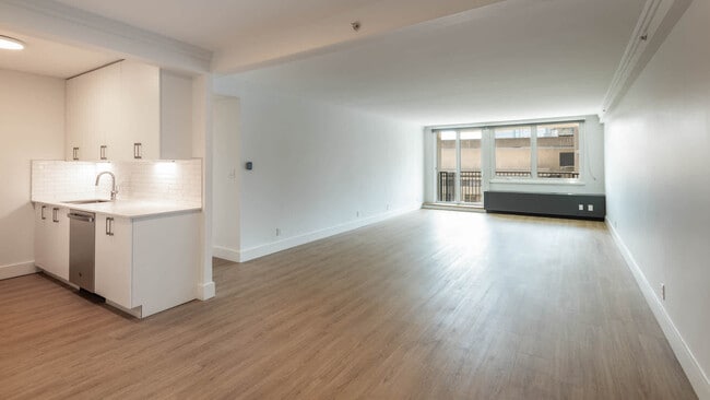 Living Room with Hard Surface Flooring - The Towers at Longfellow