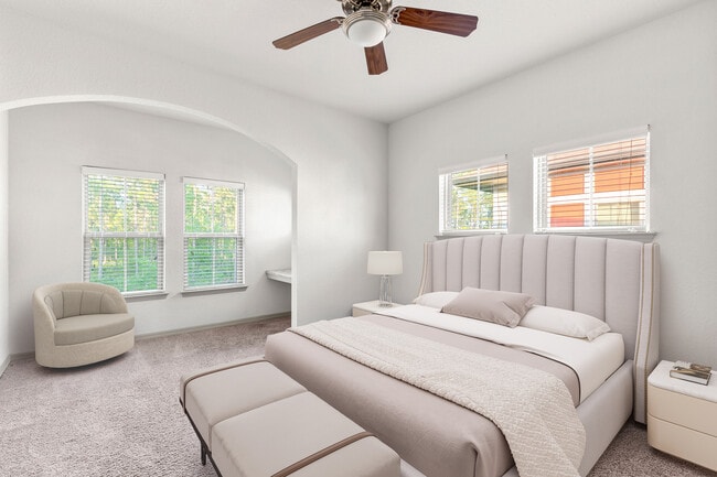 Retreat to a bedroom built for relaxation. - Sands Parc