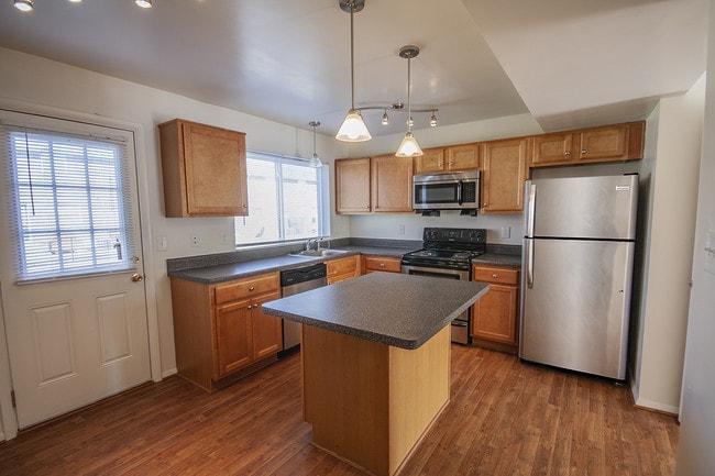 Caraway Kitchen with Vinyl Plank Flooring - The Landing at Oyster Point