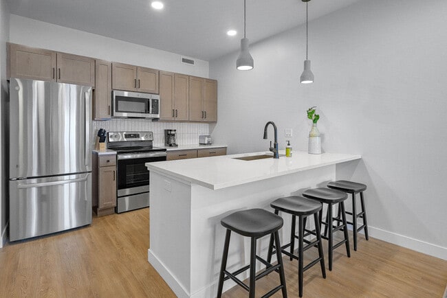 Furnished Kitchen - Urbane115 Apartments