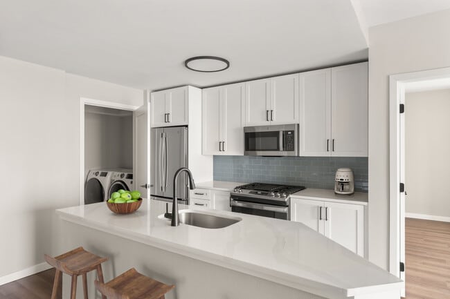 Stainless-steel appliances, Caesarstone or quartz countertops, and fully equipped kitchens elevate your cooking experience - Elevate