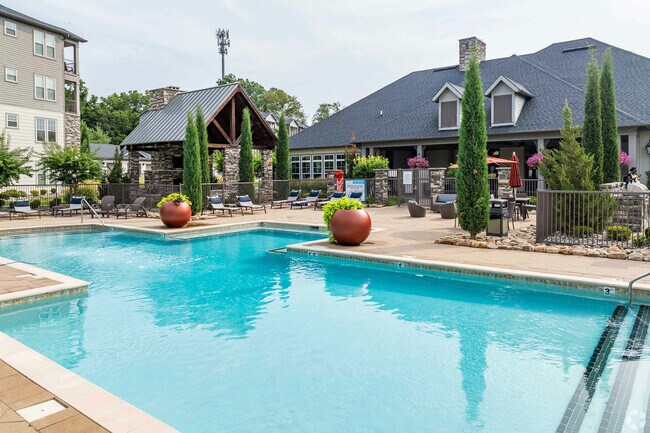 Experience tranquility at this luxurious poolside retreat, offering relaxation and style. - Springhouse