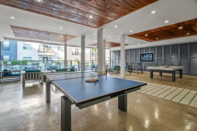Covered game room with ping pong and billiards table - Larq Henderson