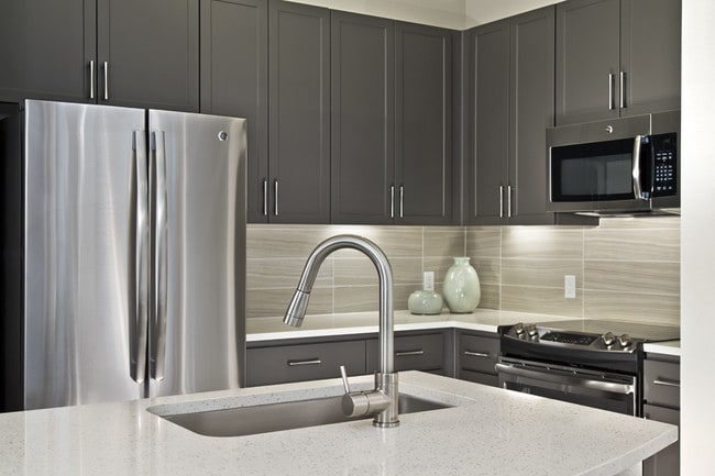 Premium quartz countertops and subway tile backsplash - District at Biltmore Apartments