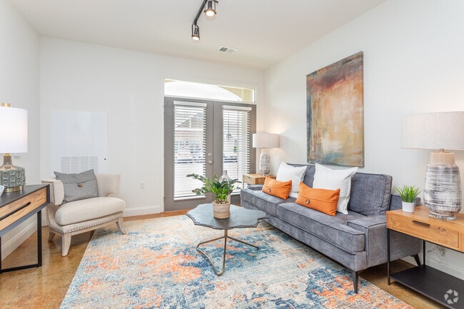 1BR, 1BA - 724SF A1C- Living Area - Comet Garner