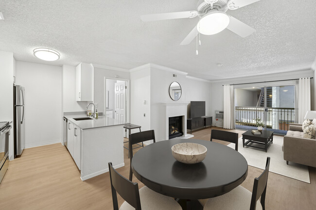 Renovated Package I kitchen, living, and dining area with hard surface flooring - eaves West Valley