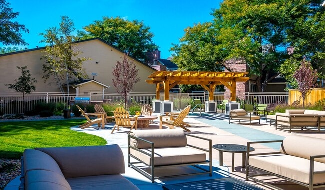 Enjoy fresh air and community vibes in cozy outdoor seating areas. - Skyview Apartment Homes
