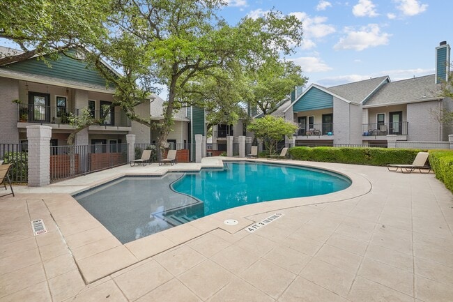 Sparkling pool with tanning deck - Apex Apartments
