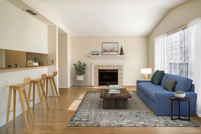 Renovated Package I kitchen and living area with hard surface flooring in common areas - eaves Fair Lakes