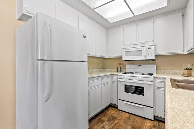 All-white kitchen at River Oaks in Oceanside, CA - River Oaks