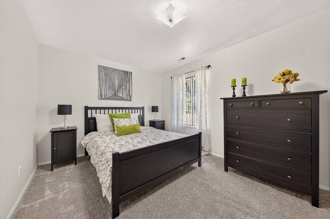 Modern bedroom with ample storage space at Eastwood Village Apartments in Clinton Township, MI. - Eastwood Village Apartments