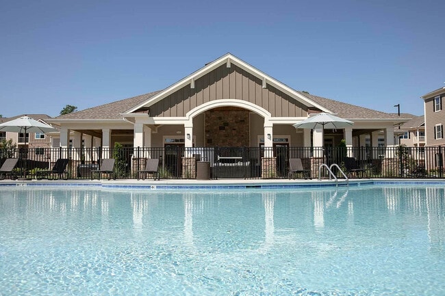 Experience resort-style living with luxurious amenities and a pristine pool. - Sanctuary at Powell Place