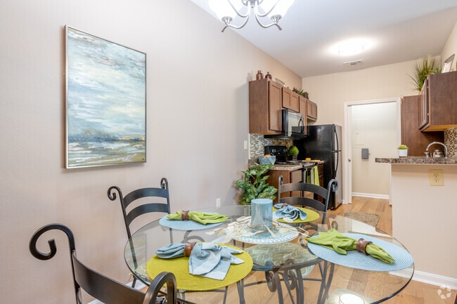 2BR, 2BA - 1,111 SF - Dining Area - Villas Of Forest Springs