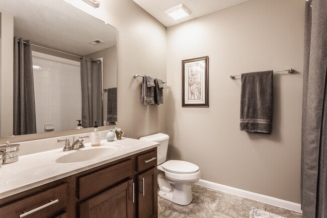 Step into a beautifully designed bathroom with a functional vanity, stylish finishes, and a bright, welcoming atmosphere. - Wheaton Village Apartments