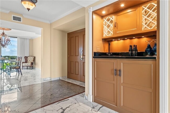 Building Photo - 7515 Pelican Bay Blvd Unit 7B