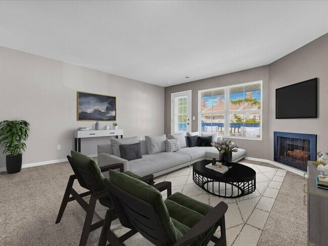 A cozy fireplace adds warmth and ambiance, while comfortable seating and contemporary décor create a relaxed yet upscale atmosphere. - Wyndham Hill