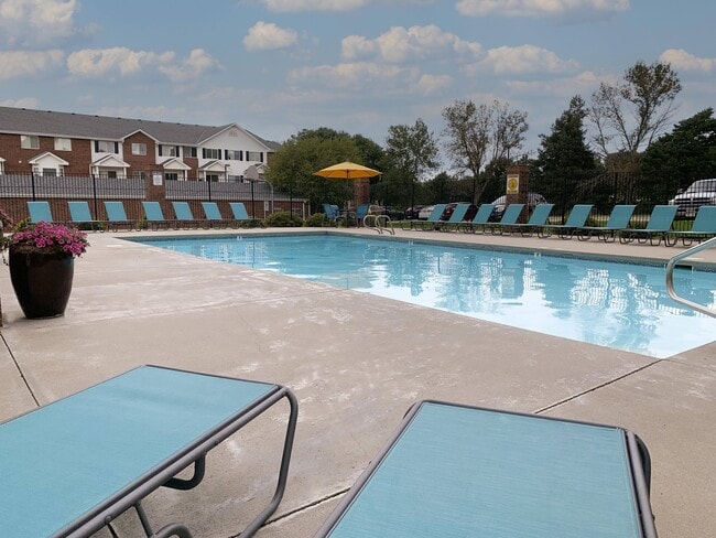 Soak up the sun or take a dip—your resort-style pool and sundeck make every day feel like a getaway. - Ridge Pointe Villas