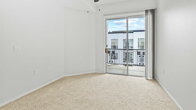 Carpeted Bedroom with Balcony - Archstone Fremont Center