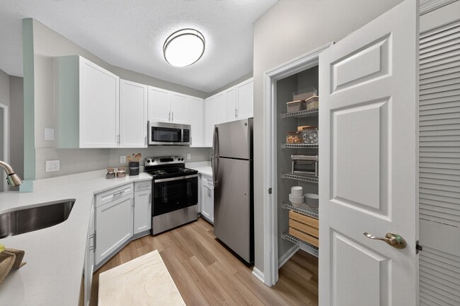 Step into the modern elegance of Eagle Rock Apartments at Belcamp with this sleek kitchen featuring stainless steel appliances and ample storage. Ideal for culinary enthusiasts and casual cooks alike. Schedule your tour today! - Eagle Rock Apartments at Belcamp