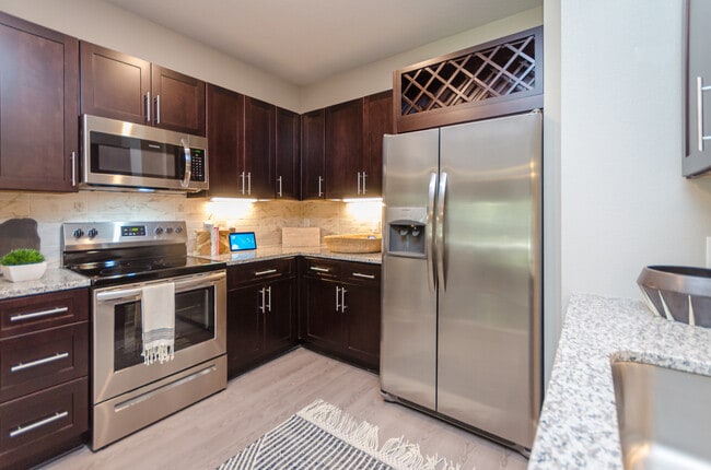 Cook, dine, and gather in a stylish kitchen space. - Cue