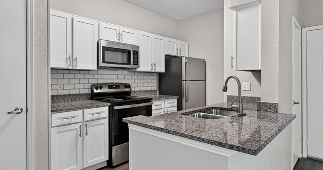 Building Photo - The Versailles Apartments