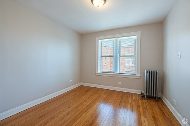 3BR, 1BA - 1,080SF - Primary Bedroom - 7526-36 S Colfax Ave