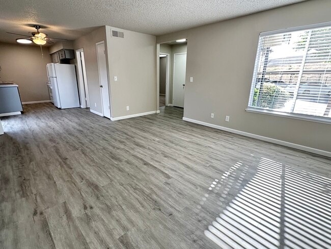 Downstairs 1x1 - Living Room - Creekside Apartments