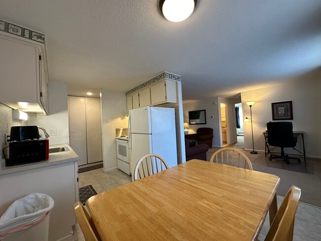 Dining Table and All Dishes and Cookware Provided to Feel at Home. - Avalon Apartments