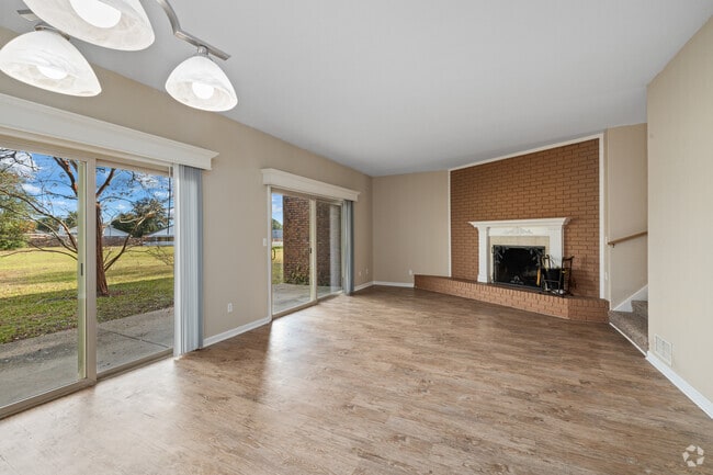 3BR, 2.5BA - 1,600SF- Living Room - Carriage Hills Apartments