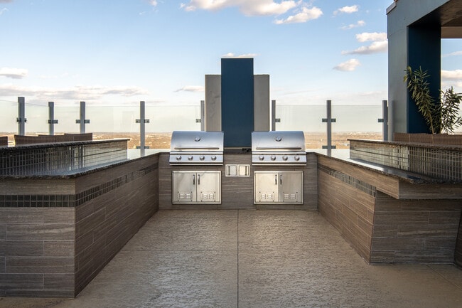 Outdoor entertainment kitchen near the rooftop lounge - SkyHouse Austin