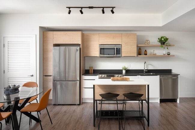 Kitchens feature granite countertops and modern Samsung appliances - Core Link at Douglas