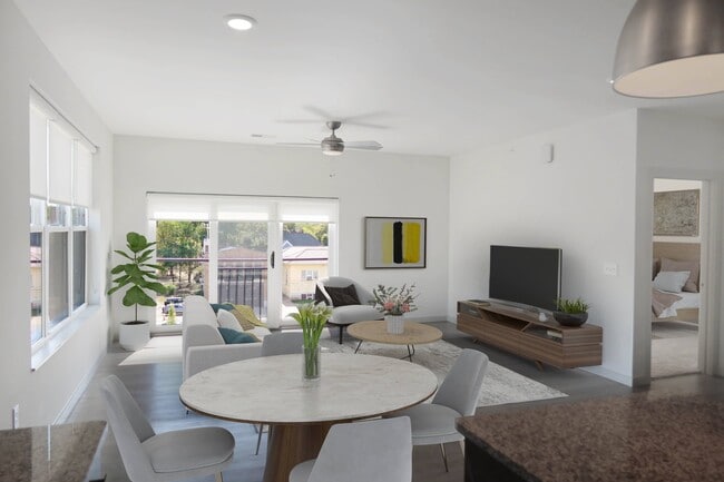 Large Living Areas with Wood Style Flooring, Ceiling Fans, and Lots of Natural Lighting - Madamore