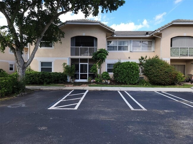 Building Photo - 12255 Royal Palm Blvd Unit 8O