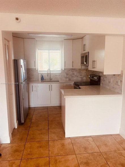 Building Photo - 7785 W 30th Ct Unit F210