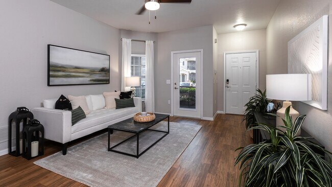 A sophisticated living space with stylish decor, a neutral color palette, and an inviting atmosphere. - Lakes of Tuscana