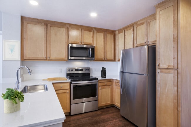 Renovated Package II Kitchen with stainless steel appliances and hard surface flooring - Avalon San Bruno