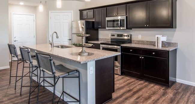 Enjoy a Spacious Kitchen, Complete with Granite Counters and a Generous Island - Redwood Brownstown Telegraph Road