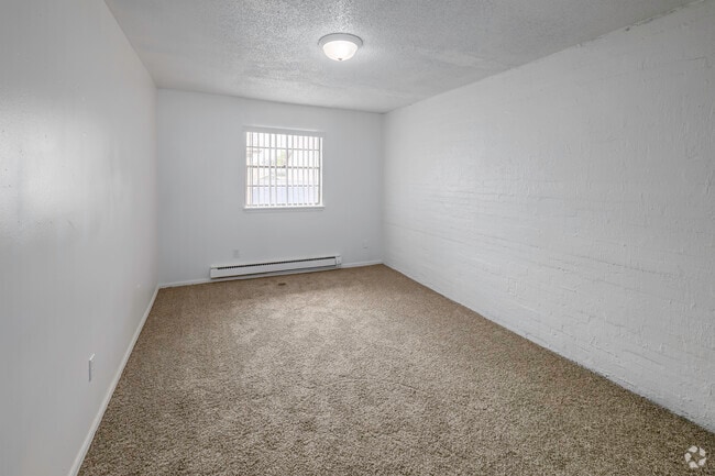 2BR, 1BA - 876SF - Primary Bedroom - Campus Pointe