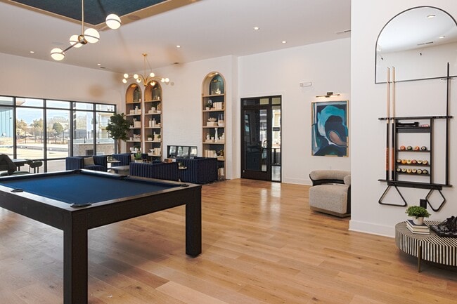 Billiards table in the resident clubhouse, offering a fun and social gathering space. - Cypress Point