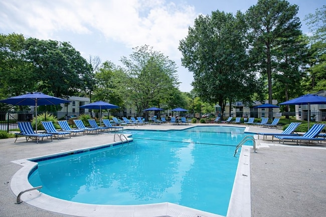 Sunny poolside retreat with lounge chairs - Monarch Crossing