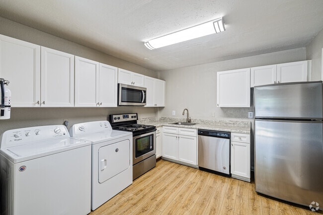 2BR, 1BA - 1050SF- Kitchen/Laundry - North Woods at The Four Seasons