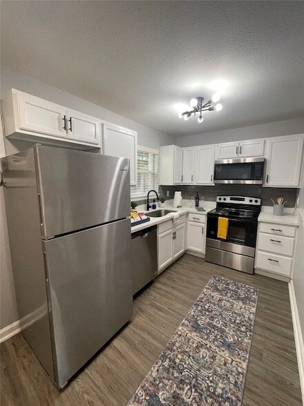 Building Photo - 1225 W 25th St Unit 2