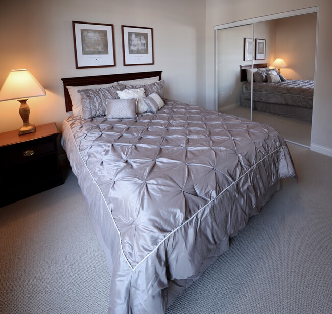 Guest Bedroom with Queen Bed - The Apartments at Corporate Cove