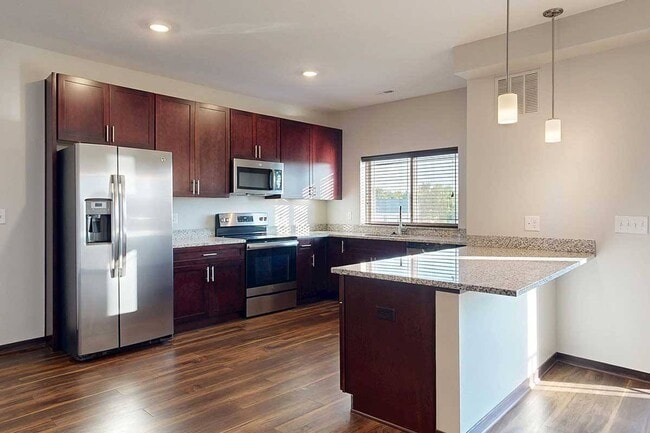 Whip up your favorites in a modern kitchen with ample counter space and stainless steel appliances. - 360 at Jordan West