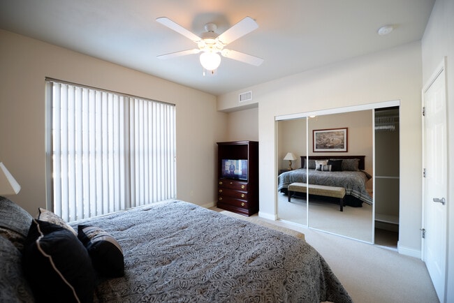 Master Bedroom with King Bed - The Apartments at Corporate Cove