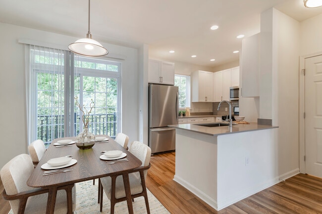 Renovated Package II kitchen and dining area with hard surface flooring - Avalon Northborough