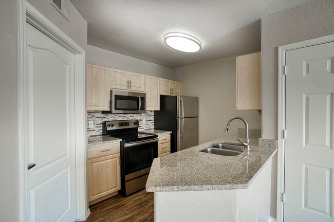 Cook, dine, and gather in a stylish kitchen space. - Indigo Creek