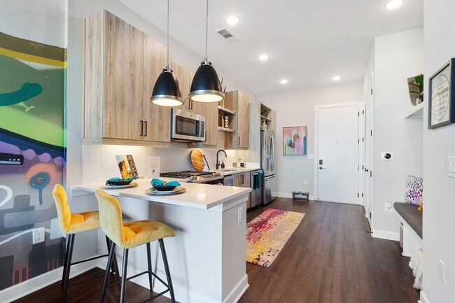 Modern kitchens with stainless steel appliances - AMLI Westside