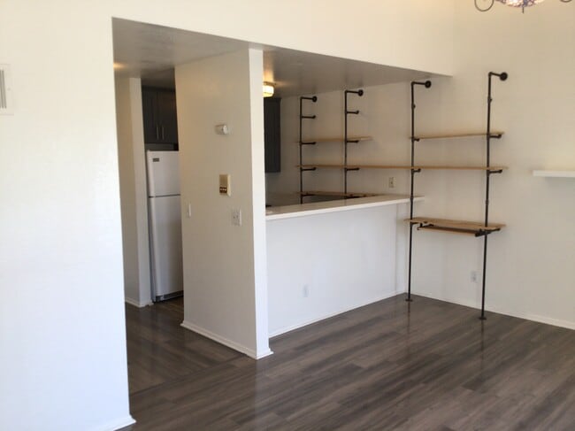 Kitchen, countertop bar, living room - 3601 Hughes Ave